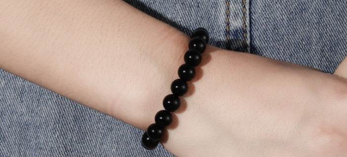 Black Onyx BraceletExperience the power of the Black Onyx Bracelet. Made with an imported elastic cord and featuring 8MM geometric black agate beads, this bracelet is not just stylish BraceletPlush Fashions ShopPlush Fashion ShopBlack Onyx Bracelet