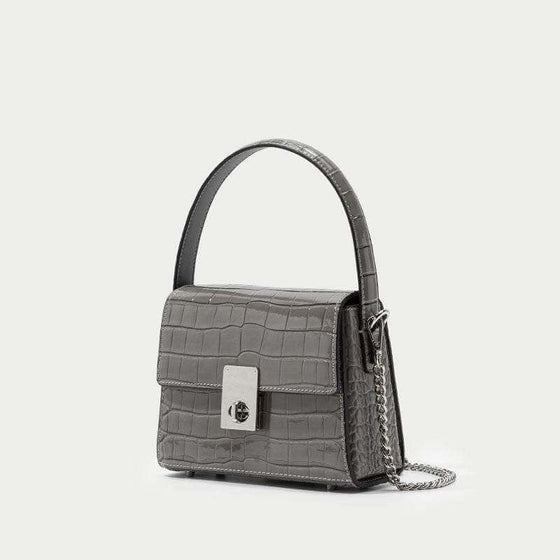 Leather handbags portable diagonal bag in high-quality leather with trapezoid shape.