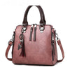 Luxury ladies handbag, soft surface, crossbody and shoulder styles, spacious design, trendy fashion accessory.