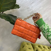 Woven small cowhide square chain handbag in orange, stylish and versatile design.