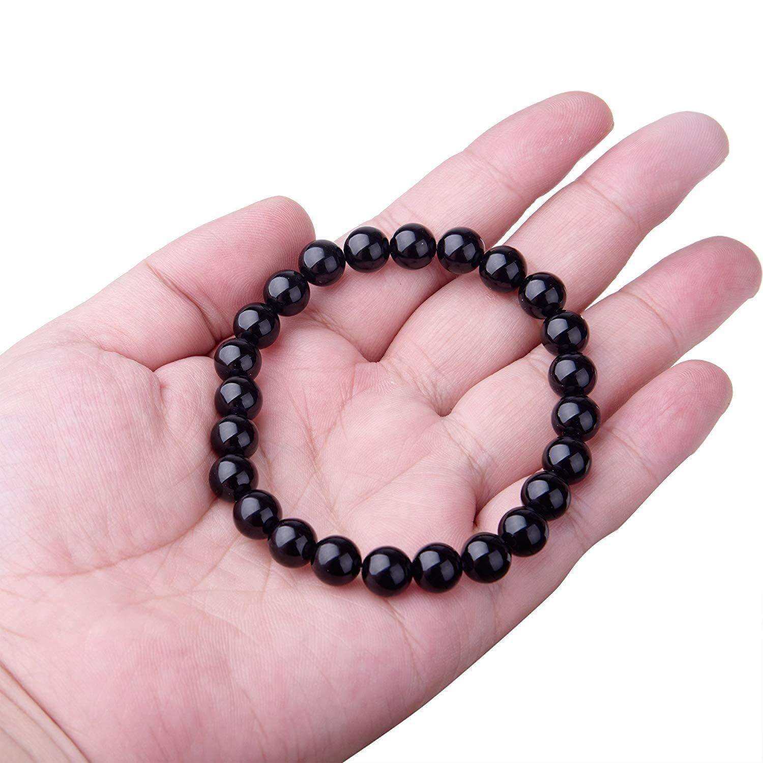 Black Onyx BraceletExperience the power of the Black Onyx Bracelet. Made with an imported elastic cord and featuring 8MM geometric black agate beads, this bracelet is not just stylish BraceletPlush Fashions ShopPlush Fashion ShopBlack Onyx Bracelet