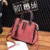 Luxury ladies handbag, soft surface, spacious with zipper, adjustable strap, crossbody style.