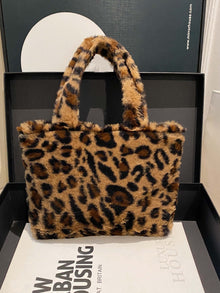  Leopard fluff handbag with zip, medium size (9.8 x 2.4 x 7.5 inches), stylish accessory for luxury outfits.