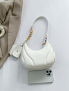 PU Leather Shoulder Bag with EarPods Bag on display with a smartphone.