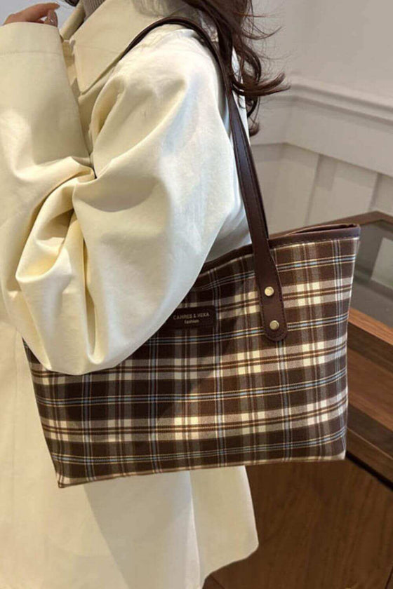 Plaid leather tote bag with chic design, perfect for everyday use.