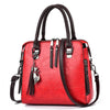 Ladies luxury handbags, crossbody bag with zipper, red color, soft material, adjustable shoulder strap.