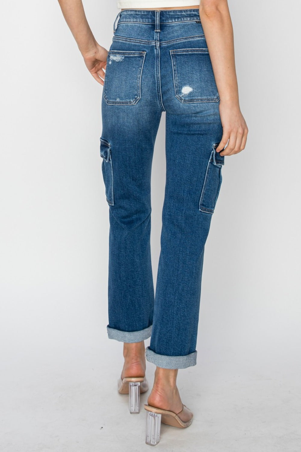 Women's Full Size High Rise Cargo Ankle Roll Up Straight JeansElevate your wardrobe with the trendy and functional RISEN High Rise Cargo Ankle Roll Up Straight Jeans. The high-rise fit accentuates your waist while providing comDenim JeansPlush Fashion ShopPlush Fashion ShopFull Size High Rise Cargo Ankle Roll