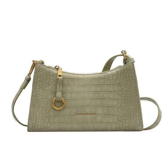 Women's Everyday fashion handbag, small green square bag with zipper and metal elements.