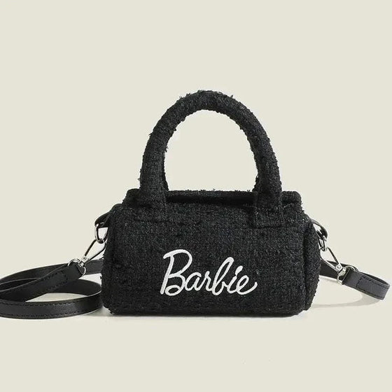 Women Fashion Pillow Barbie Hand Bag in black with cylindrical shape and stylish design.