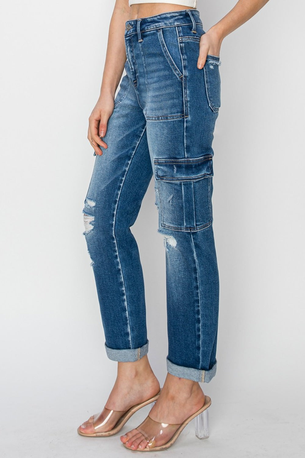 Women's Full Size High Rise Cargo Ankle Roll Up Straight JeansElevate your wardrobe with the trendy and functional RISEN High Rise Cargo Ankle Roll Up Straight Jeans. The high-rise fit accentuates your waist while providing comDenim JeansPlush Fashion ShopPlush Fashion ShopFull Size High Rise Cargo Ankle Roll