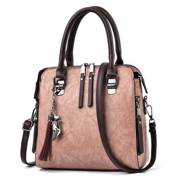 Luxury ladies handbag with soft surface, zipper opening, spacious design, and adjustable strap in a crossbody style.